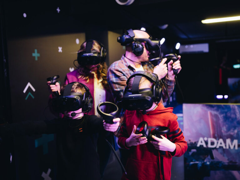 Family playing free roaming zombie shooter | A'DAM VR